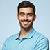 portrait-of-young-european-man-on-blue-background--WWV3RRH